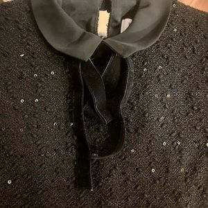 Sparkly black, short sleeve collared dress.